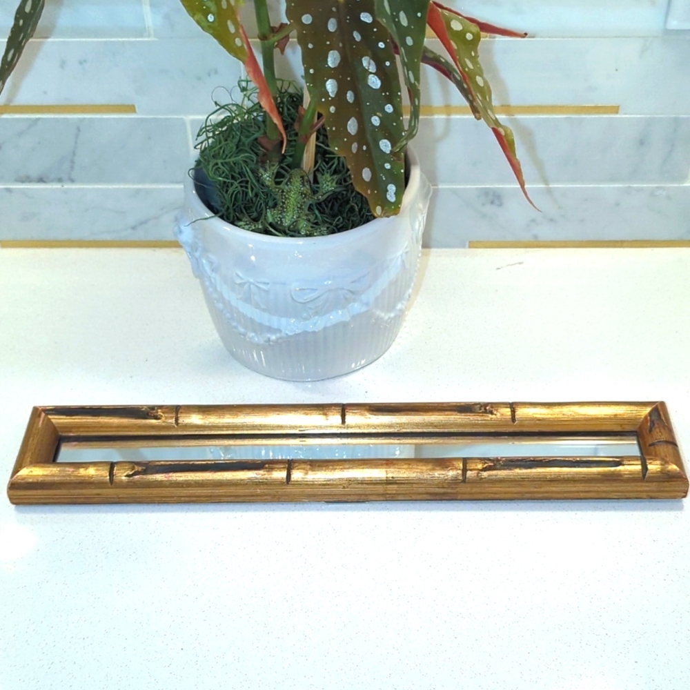 Unique Vintage bamboo mirror. Approx 2.5" x 13.5".